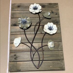 Metal flowers with wood backing wall art